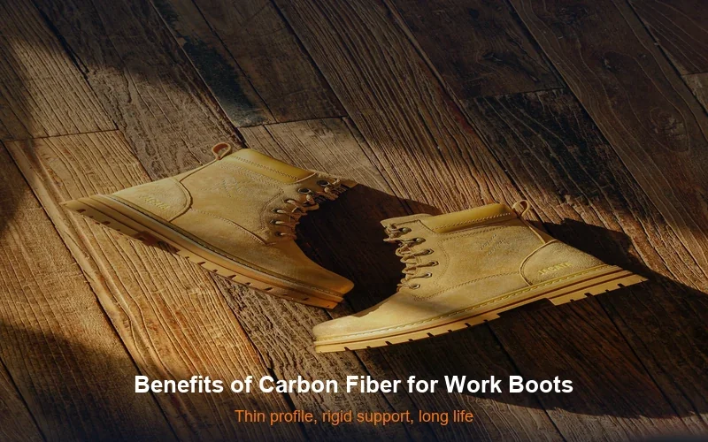 Tan work boots on rustic wooden floor in natural lighting - benefits of carbon fiber insoles